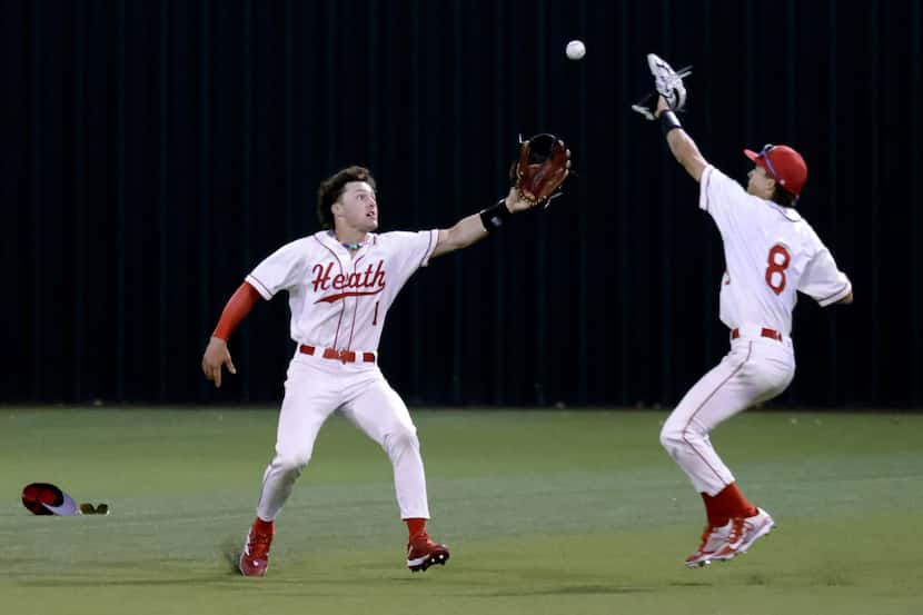 Rockwall-Heath High (1) and (8) field a ball on the hop from Celina High batter Major...