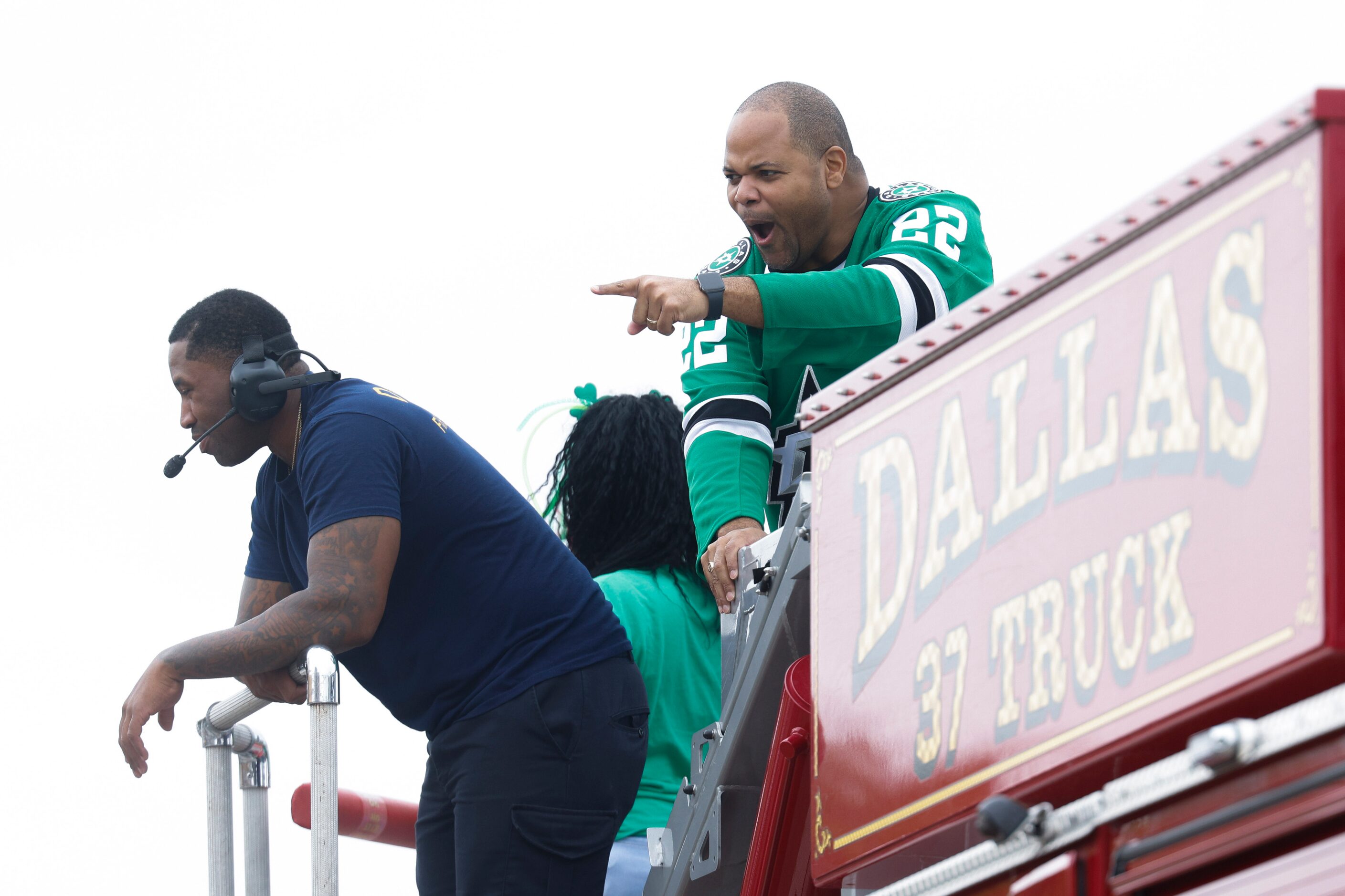 Dallas Mayor Eric Johnson cheers towards the crowd during a Saint Patrick's Day parade on...