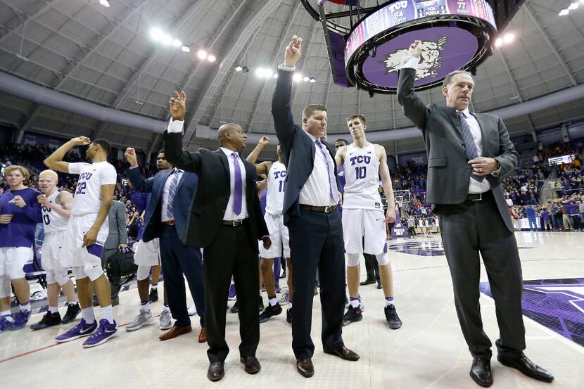 TCU Horned Frogs head coach Jamie Dixon (right) join the team celebrating a 84-77 win over...
