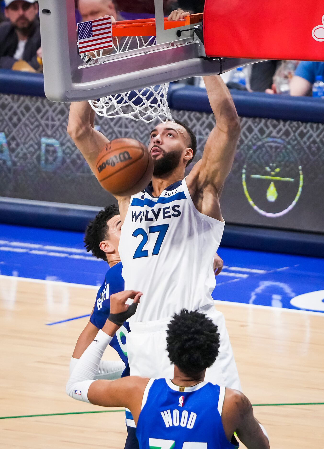 Minnesota Timberwolves center Rudy Gobert (27) dunks over Dallas Mavericks guard Jaden Hardy...