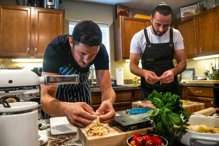 Benchmark Hospitality chef Kyle Wilson (left) and sous-chef Kreshnik Mucllari prepared pasta...
