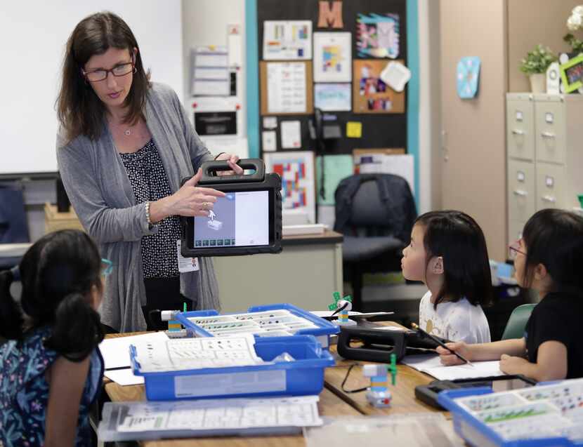 Teacher Kim Madden with students Friday at Isbell Elementary School in Frisco. 