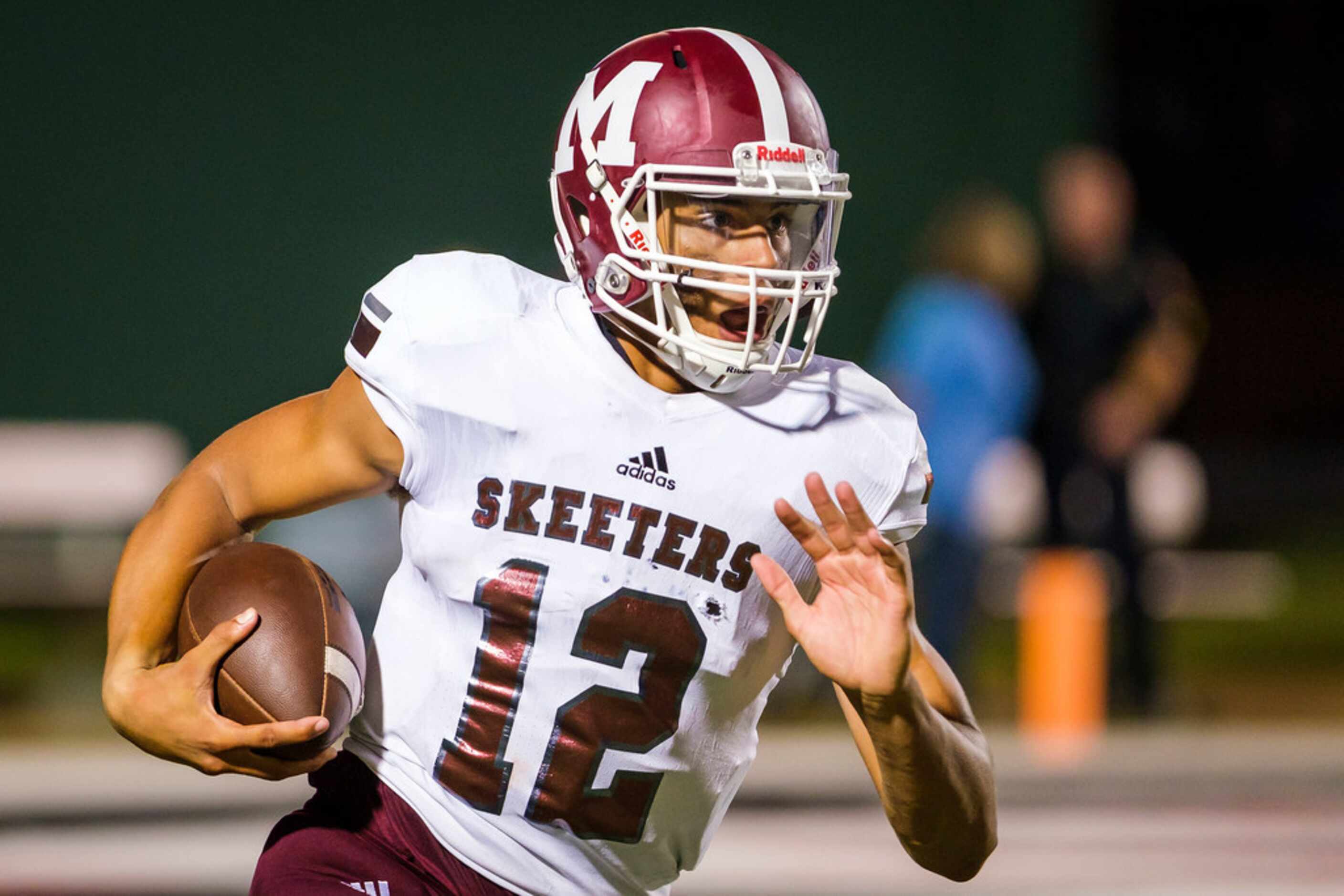 Mesquite quarterback Dylan Hillard-McGill (12) finds room to run on a 88-yard touchdown run...