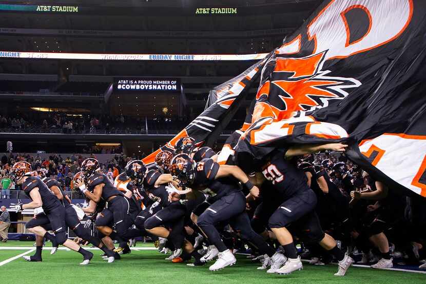 Aledo players take the field before a Class 5A Division II state semifinal game against...