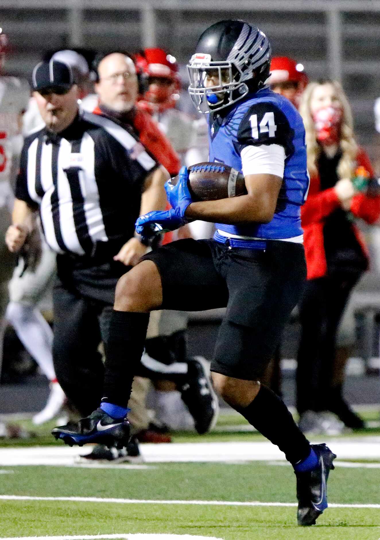 North Forney High School wide receiver Lemarcus Kirk (14) makes a big gain after the catch...