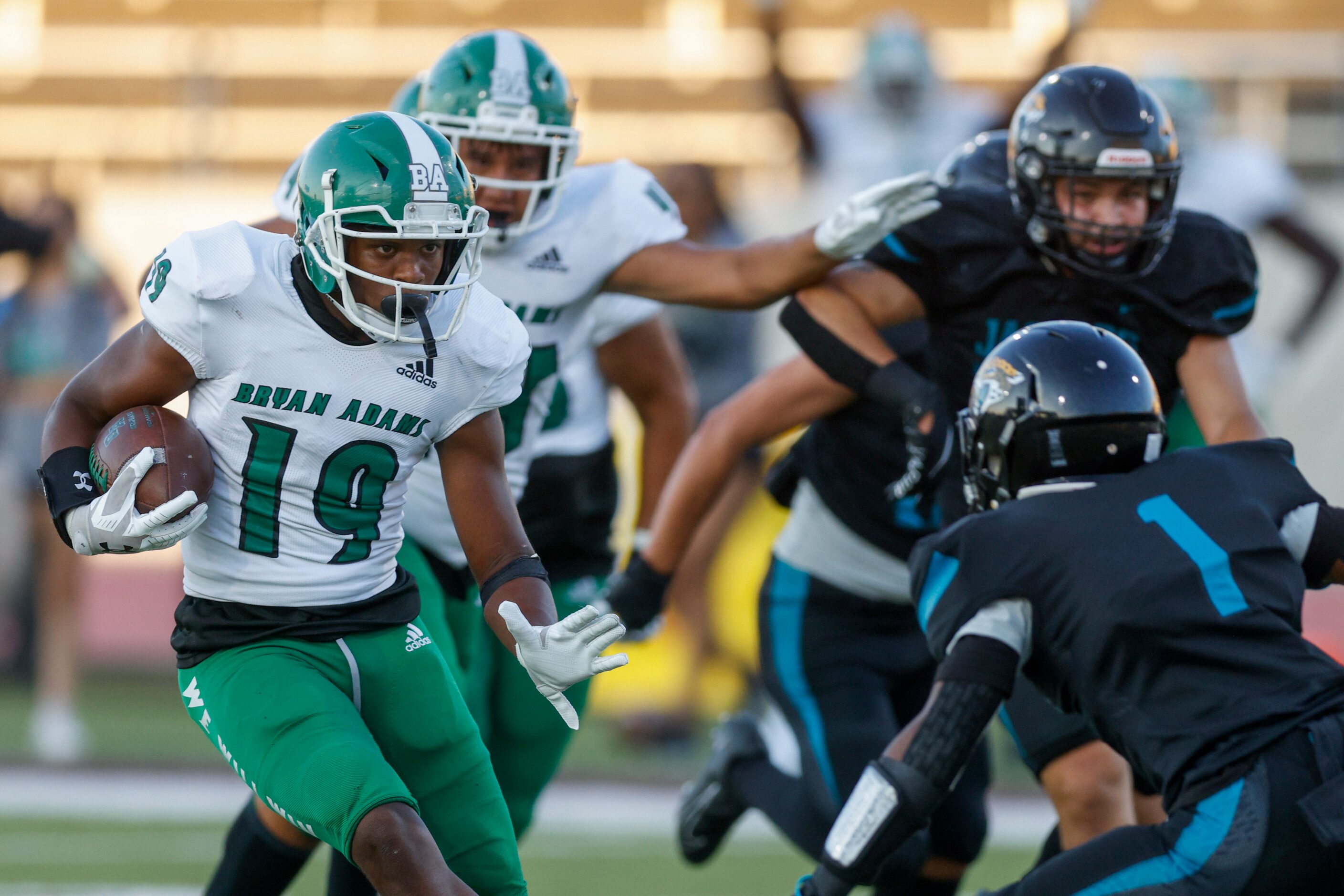 Bryan Adams running back Jon’Trevious Nunn (19) makes a cut to avoid Molina defensive back...