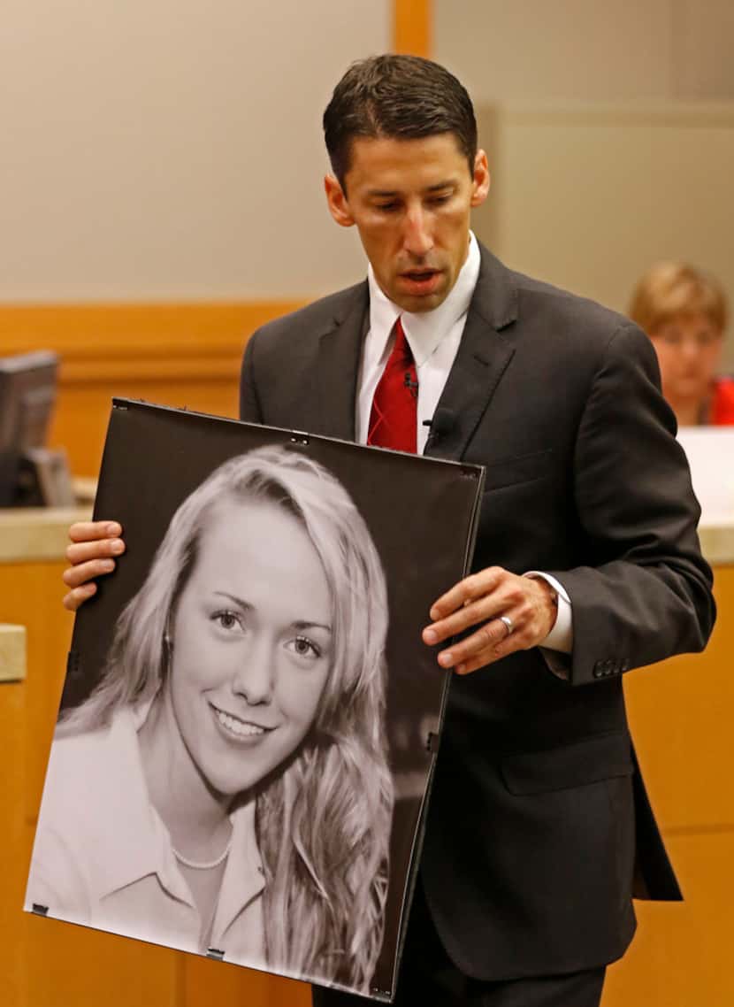 Prosecutor Wes Wynne holds a picture of Jessie Bardwell while making an opening statement in...