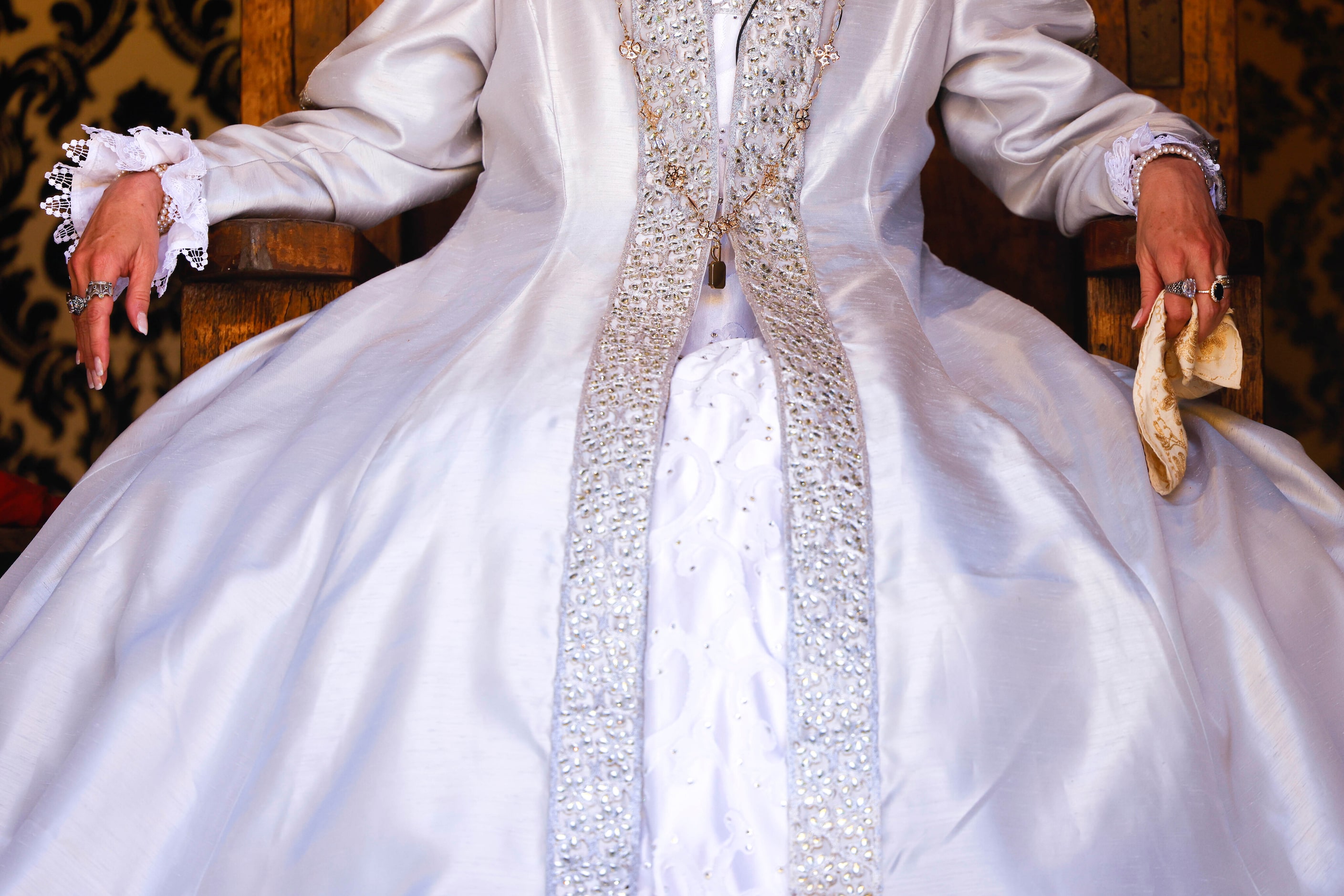 Actress Janna Zepp, playing Queen Catherine Parr sits by King Henry VIII on the throne...