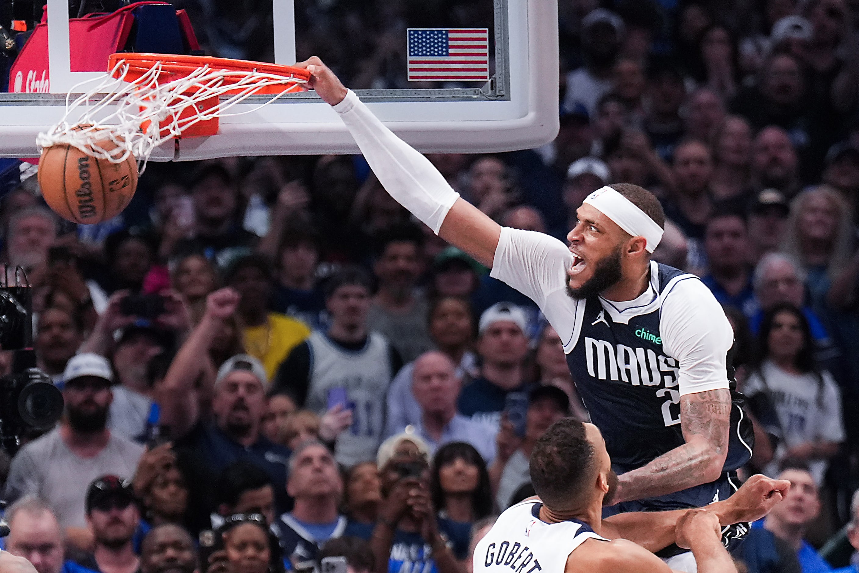 Dallas Mavericks center Daniel Gafford (21) dunks on Minnesota Timberwolves center Rudy...