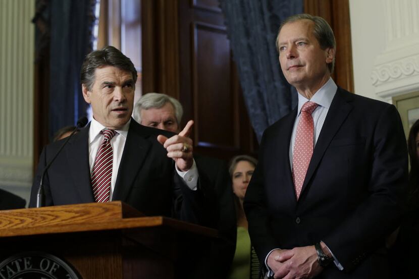 In this May 28, 2013 file photo, Lt. Gov. David Dewhurst , right, stands with Gov. Rick...