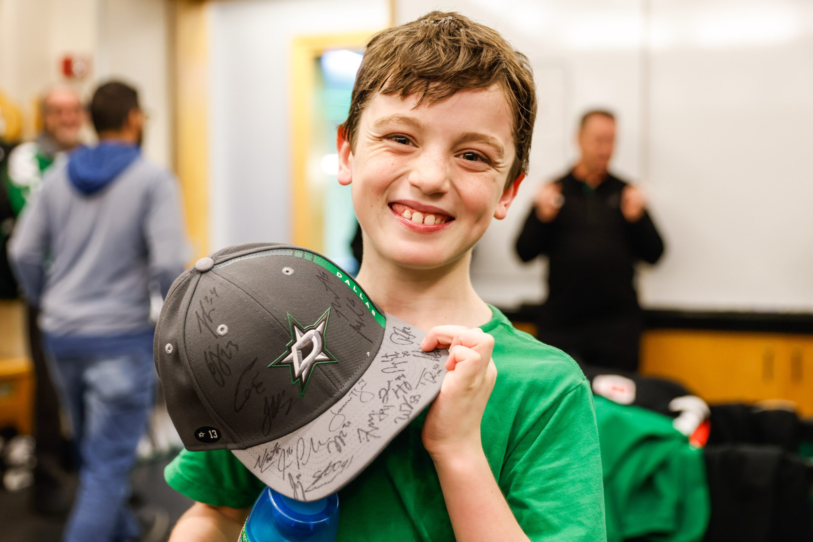 Max Hinojosa, 9, poses for a portrait with his cap signed by the Dallas Stars players at the...