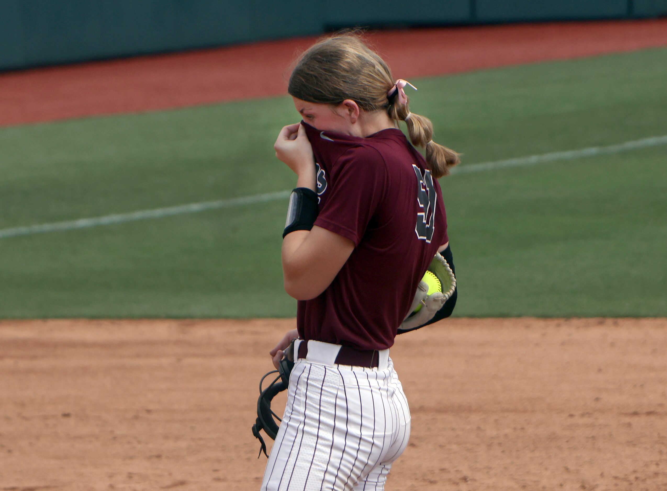 Frisco Heritage pitcher Jensin Hall (51) takes a breather between batters during the bottom...