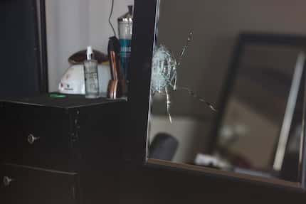 A shattered mirror inside Hair World Salon on Thursday, May 12, 2022 in Dallas, Texas....