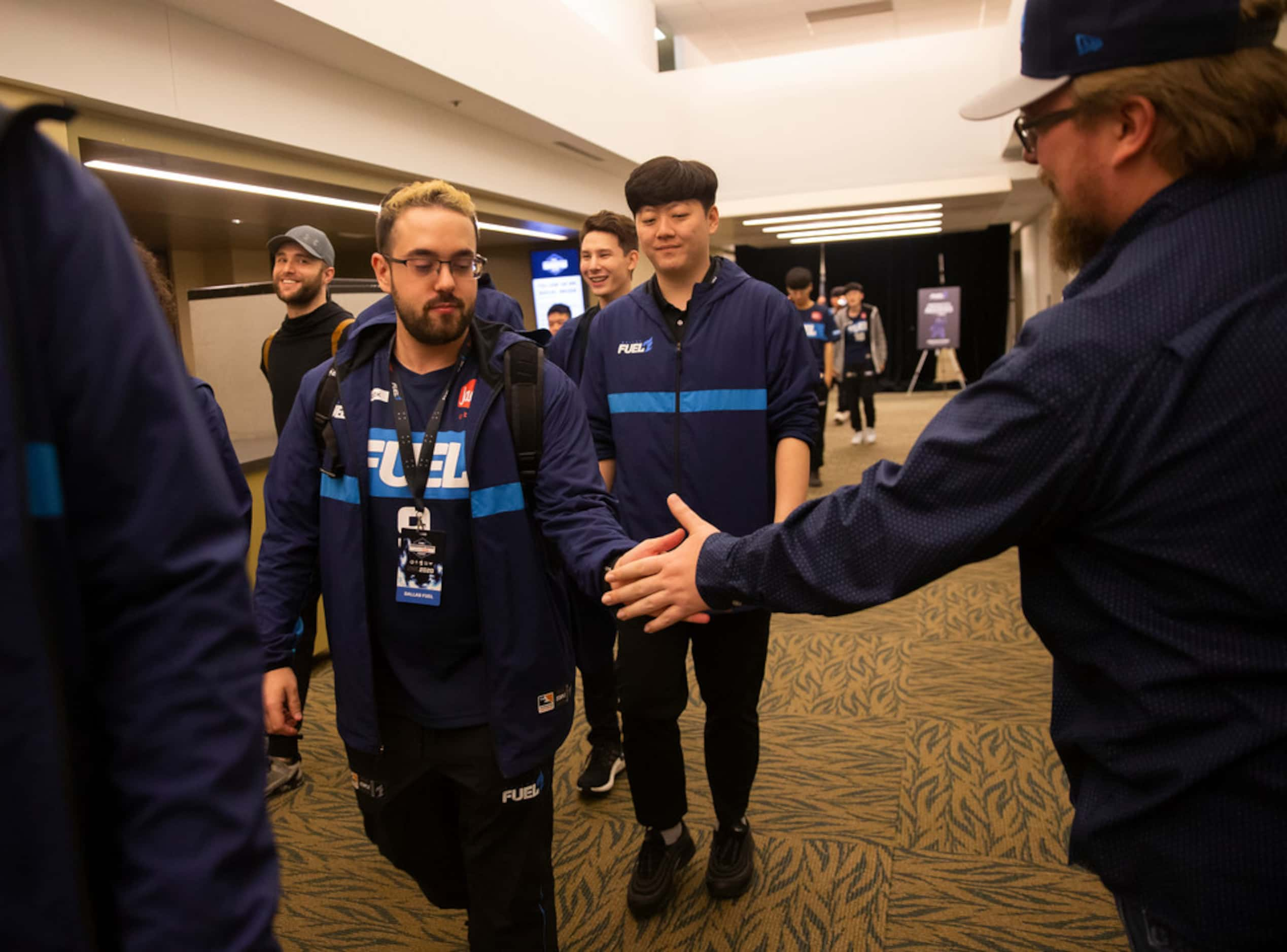 Jonathan 'HarryHook' Tejedor Rua of the Dallas Fuel high fives a fan following their 3-1...