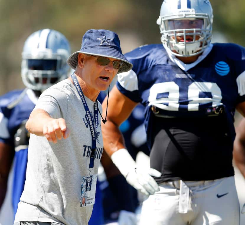 Dallas Cowboys defensive coordinator Rod Marinelli gives instruction to his players during...