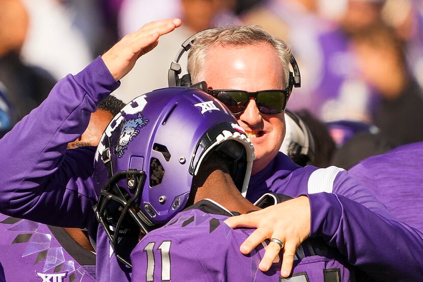 TCU head coach Sonny Dykes celebrates with wide receiver Derius Davis (11) after returned a...
