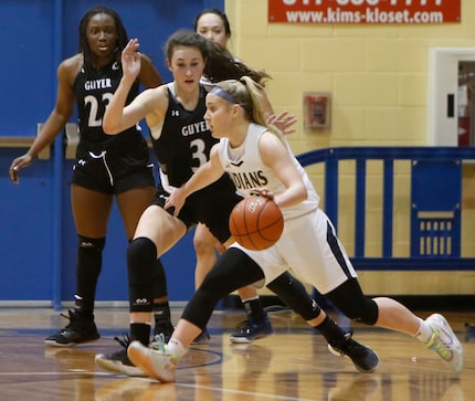 Keller guard Cambridge Mathews (2) moves the ball laterally against the defense of Denton...