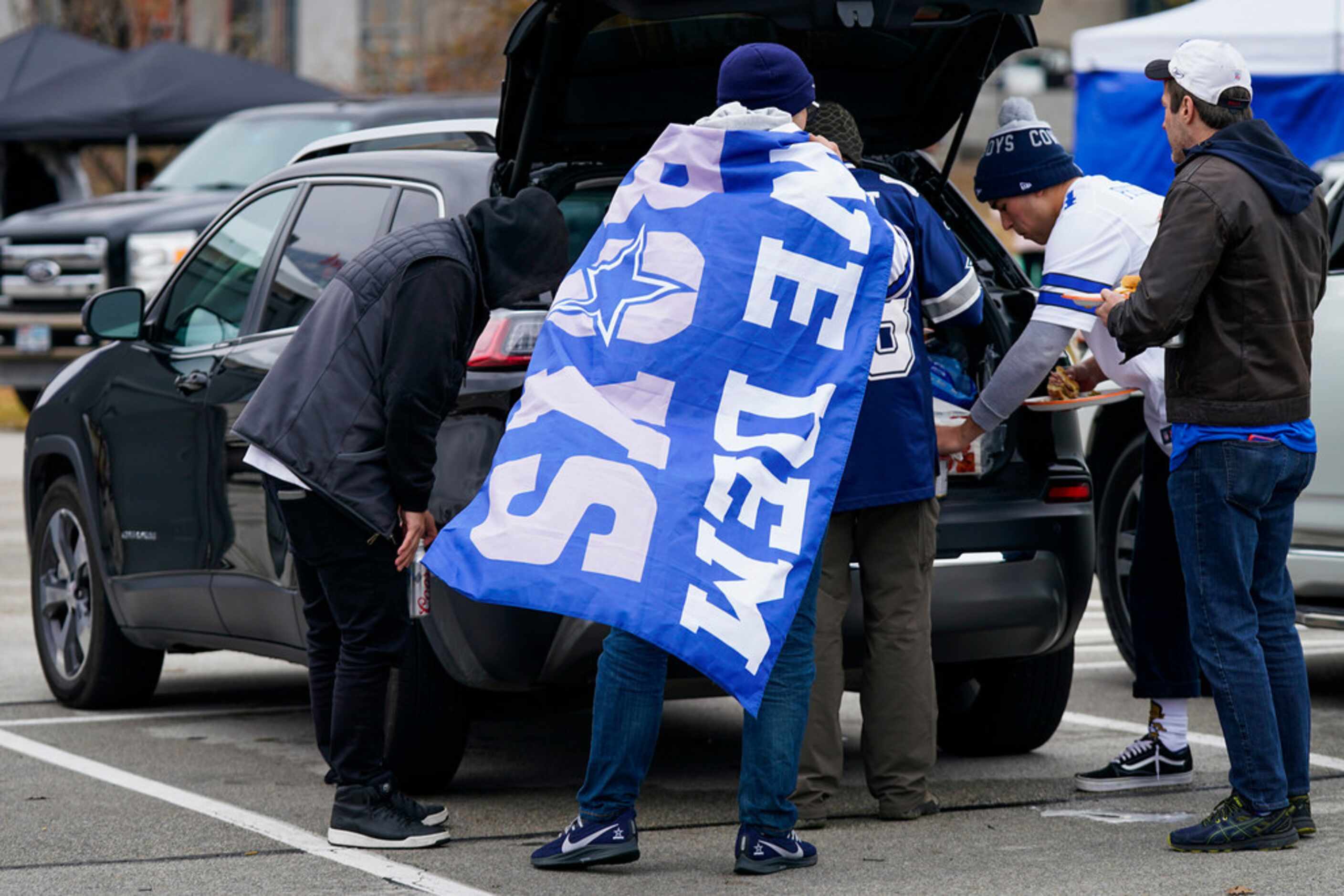 Fans tailgate before an NFL football game between the Dallas Cowboys and the Buffalo Bills...