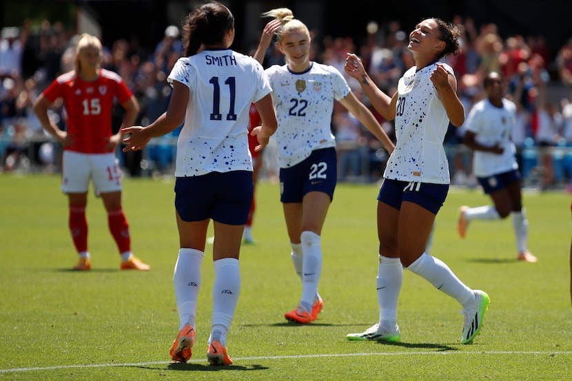 U.S. players Sophia Smith (11), Kristie Mewis (22) and Trinity Rodman (20) celebrated after...