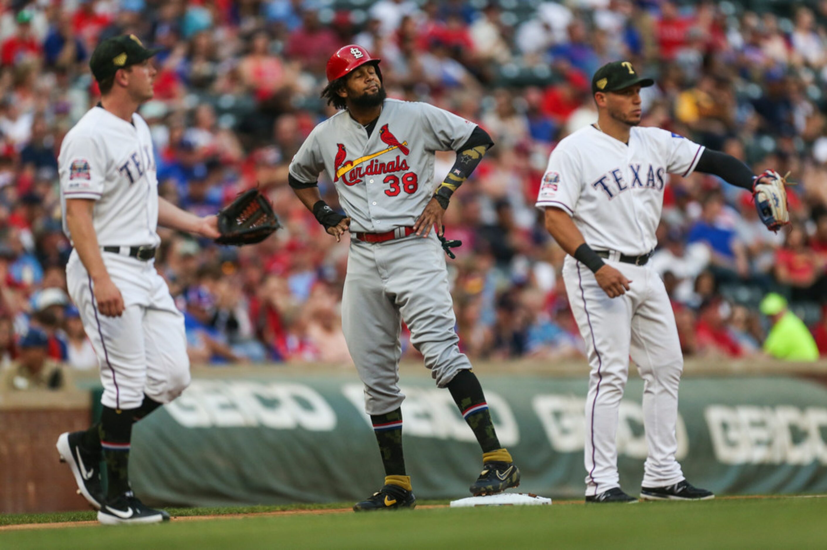 St. Louis Cardinals designated hitter Jose Martinez (38) reacts after making it safe to...