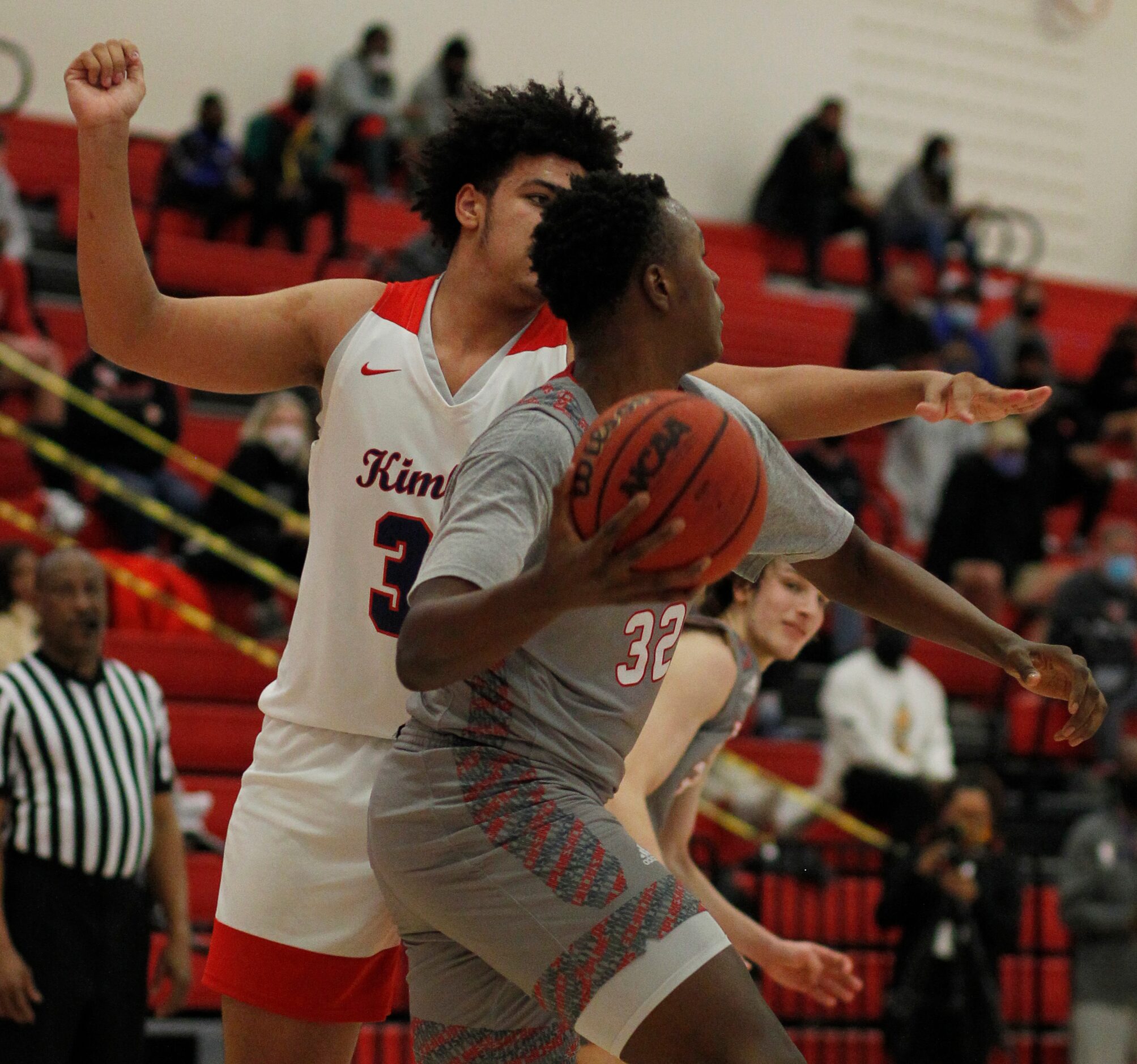 Dallas Woodrow Wilson's Deshawn Jagwan (32) looks to make a long pass as he is defended by...