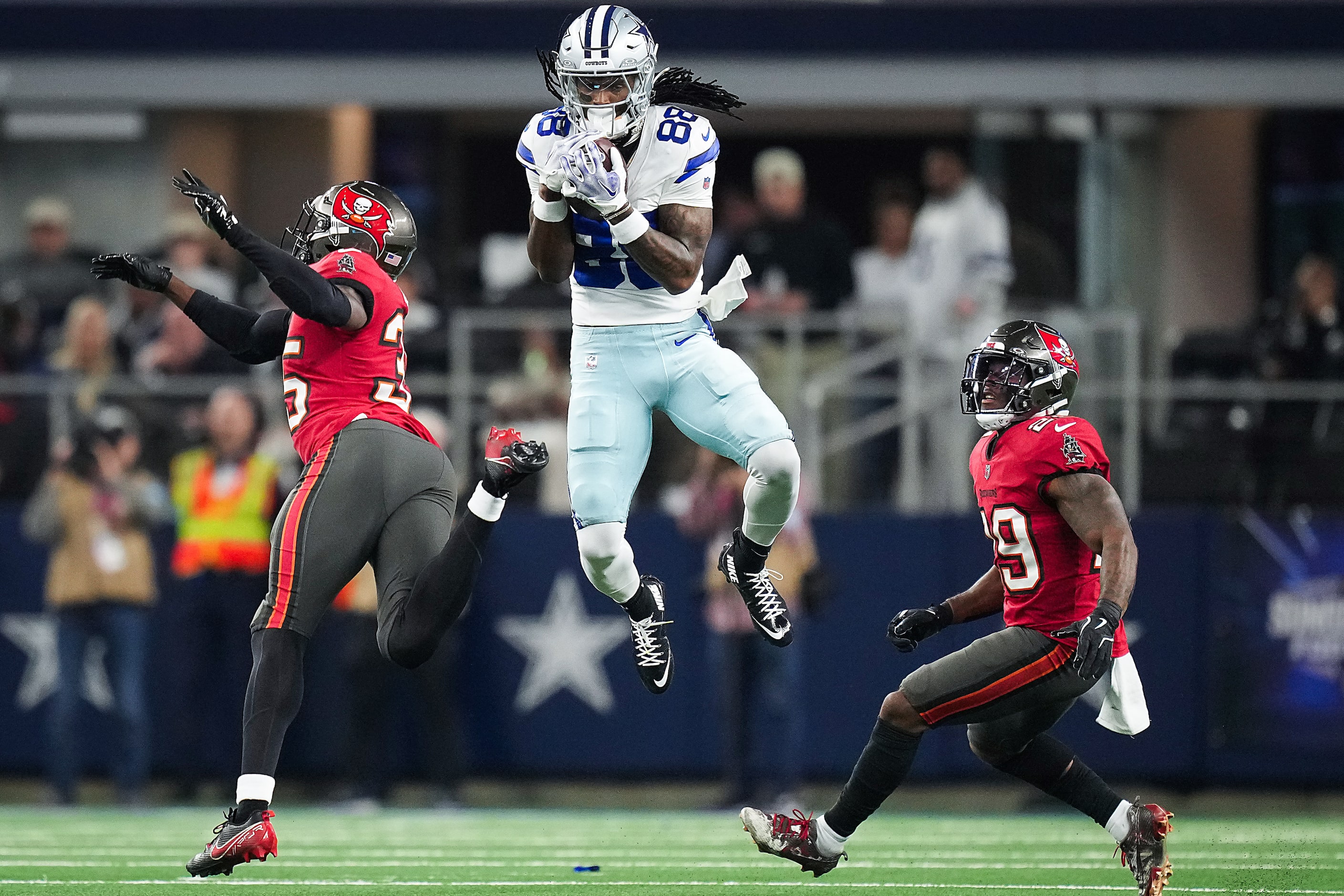 Dallas Cowboys wide receiver CeeDee Lamb (88) makes a leaping catch past Tampa Bay...