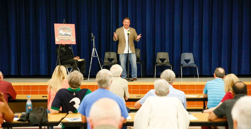 Will Wiggins of North Texas Property Tax Services speaks to a crowd at a property tax...