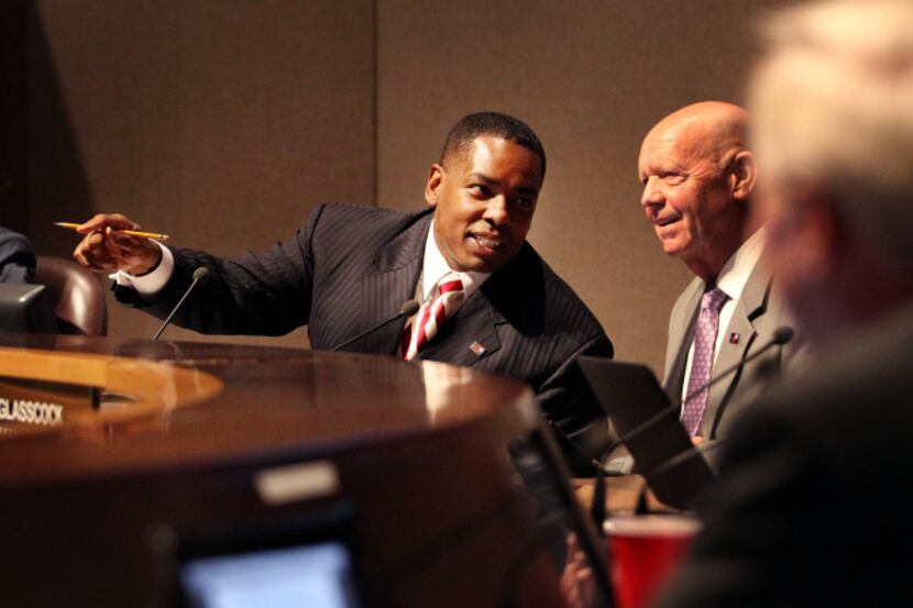 Plano Mayor Harry LaRosiliere conferred with City Manager Bruce Glasscock during Tuesday...