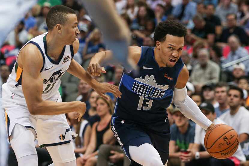 Dallas Mavericks guard Jalen Brunson (13) drives past Utah Jazz guard Dante Exum (11) during...