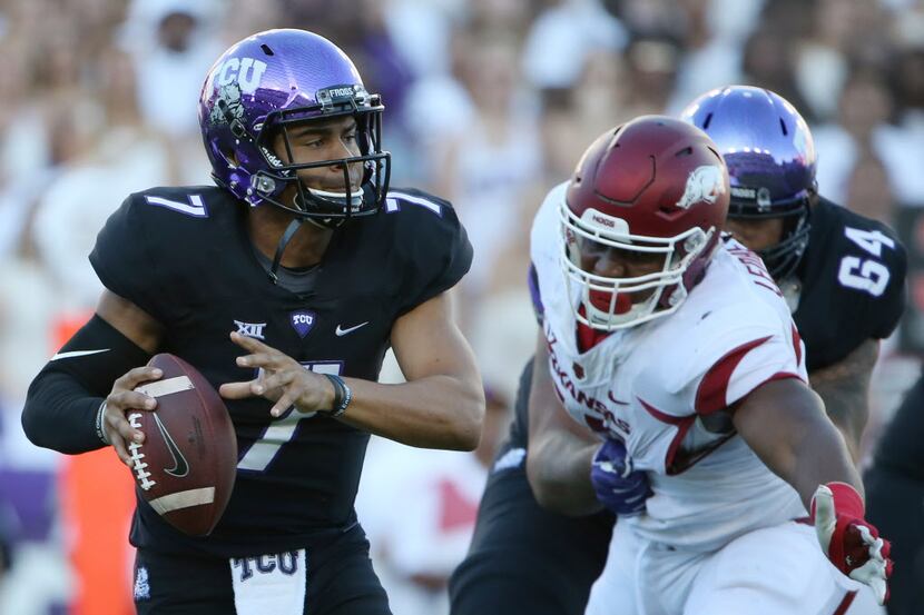 TCU quarterback Kenny Hill runs with the ball during an NCAA football game between the...