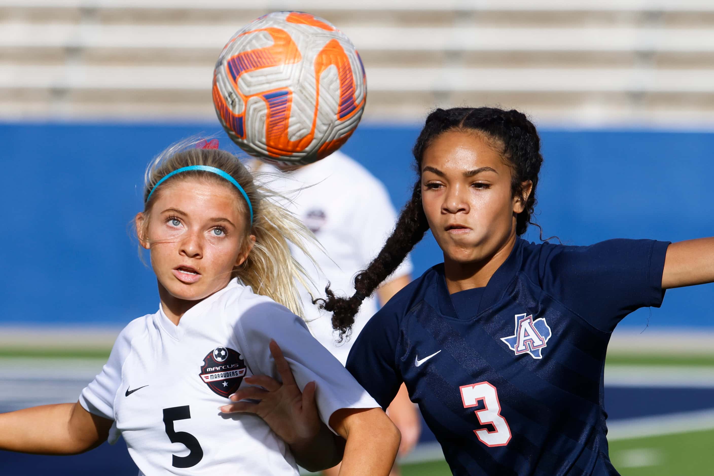 Marcus’ Savannah Wylie (left) and Allen’s Ava McDonald fights for possession during the...