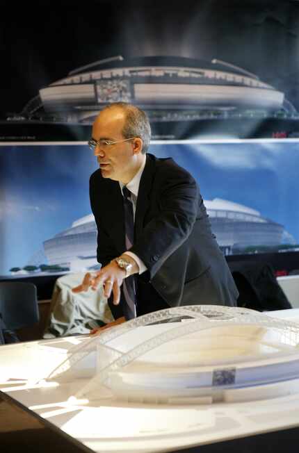 A 2006 file photo shows Bryan Trubey with a model of what became AT&T Stadium.