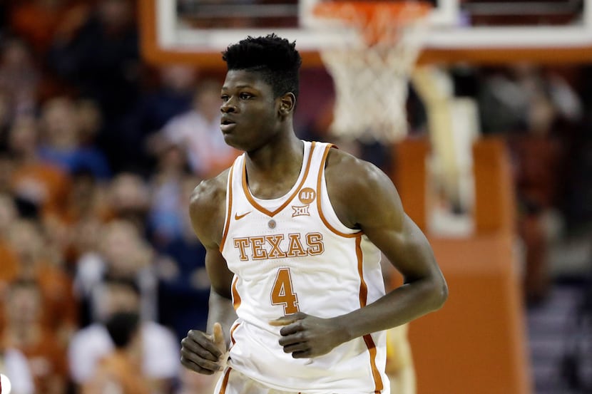 Texas forward Mohamed Bamba (4) runs up court during the first half of an NCAA college...