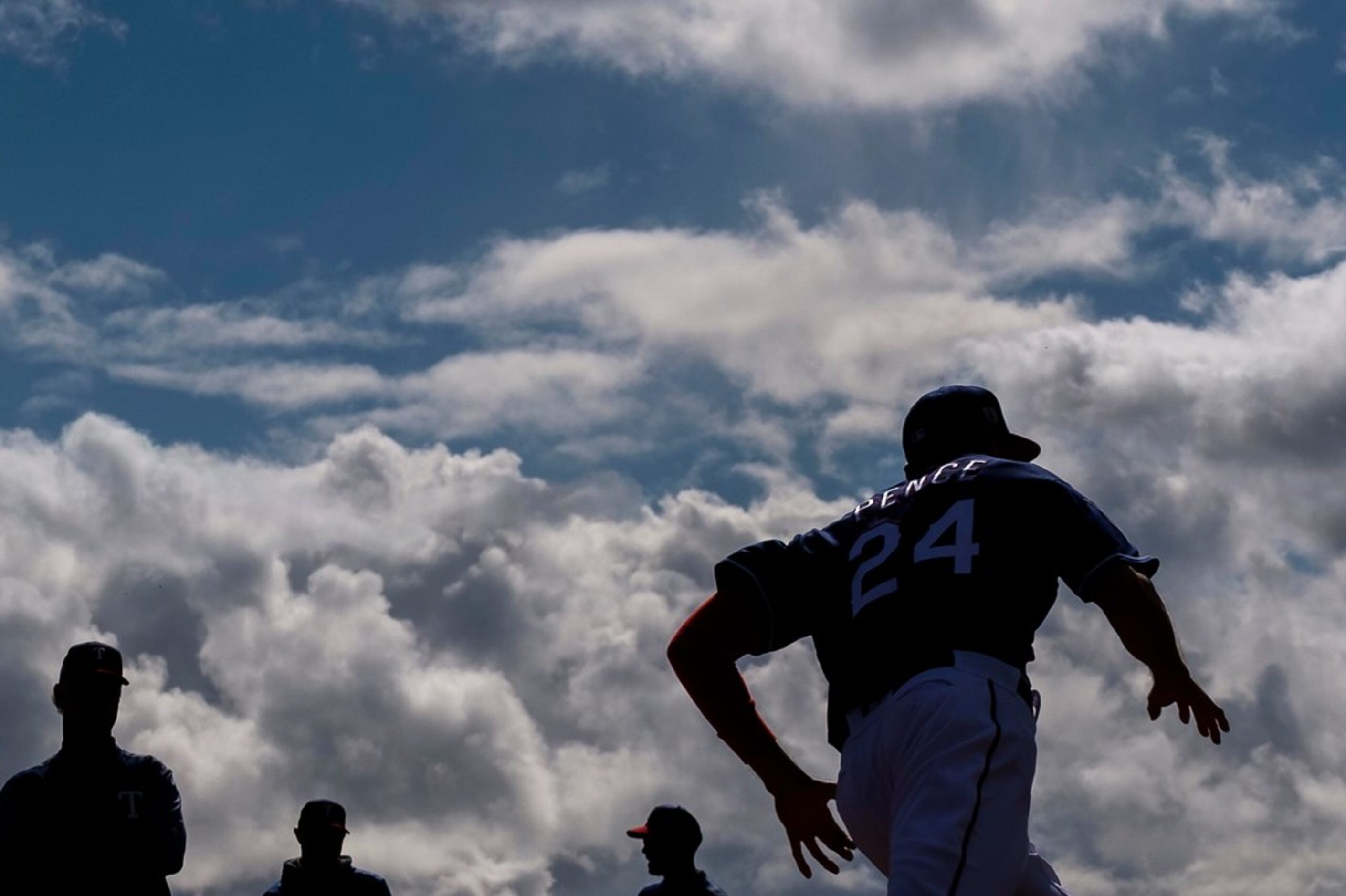 Texas Rangers outfielder Hunter Pence participates in a base running drill during the first...