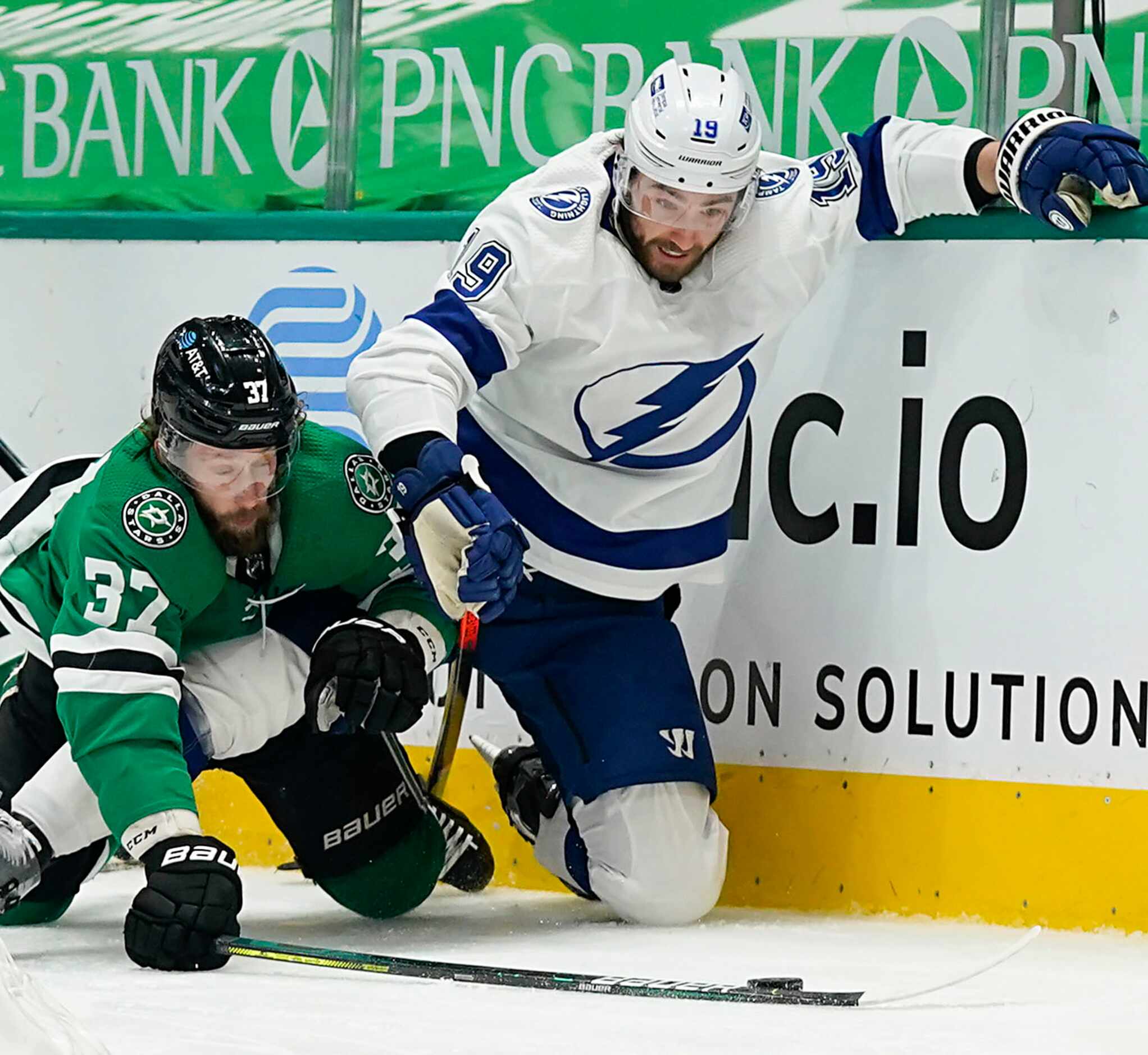 Dallas Stars center Justin Dowling (37) fights for the puck against the boards with Tampa...