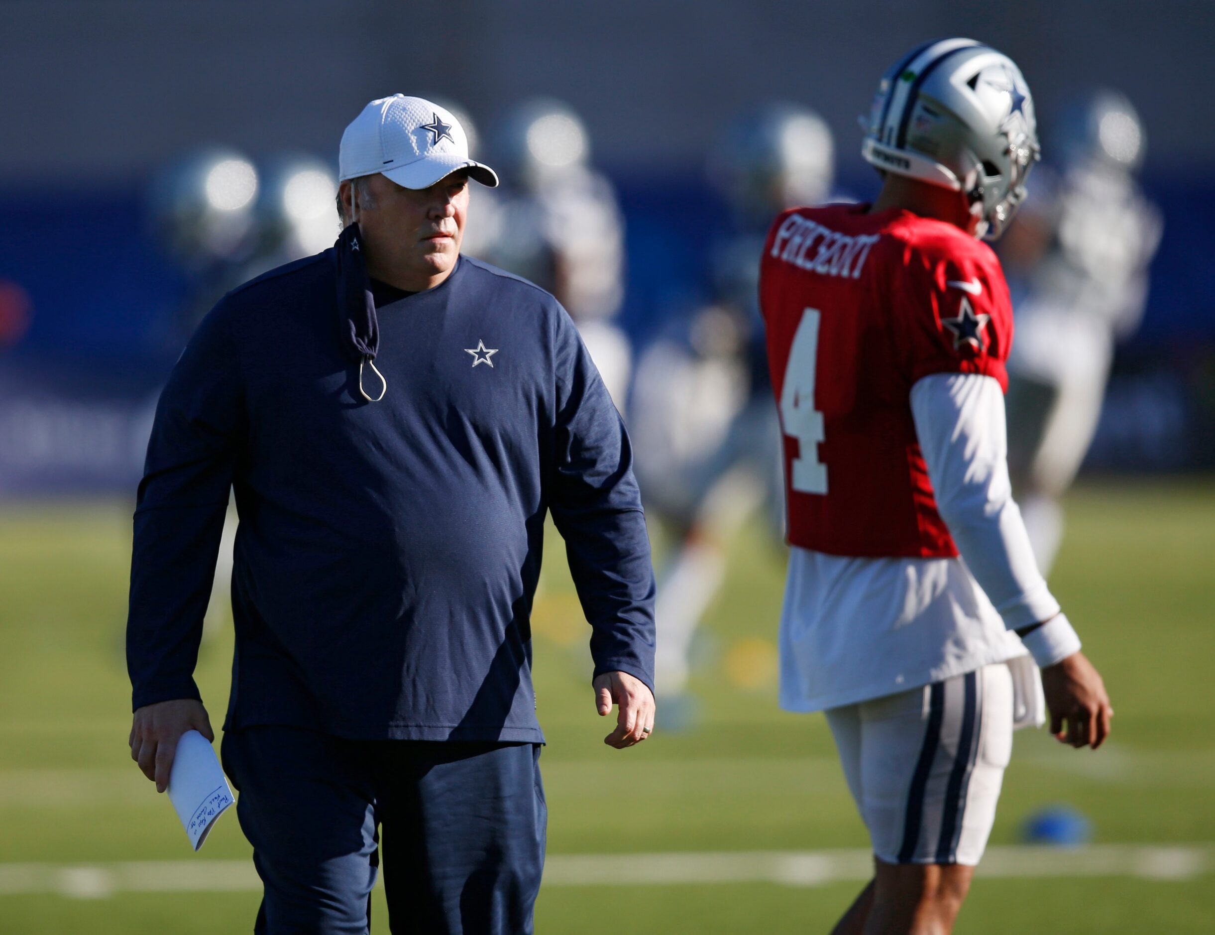 Dallas Cowboys head coach Mike McCarthy watches the quarterbacks go through drills during...