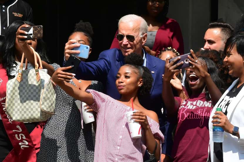 Former Vice President and Democratic presidential hopeful Joe Biden posed for selfies while...
