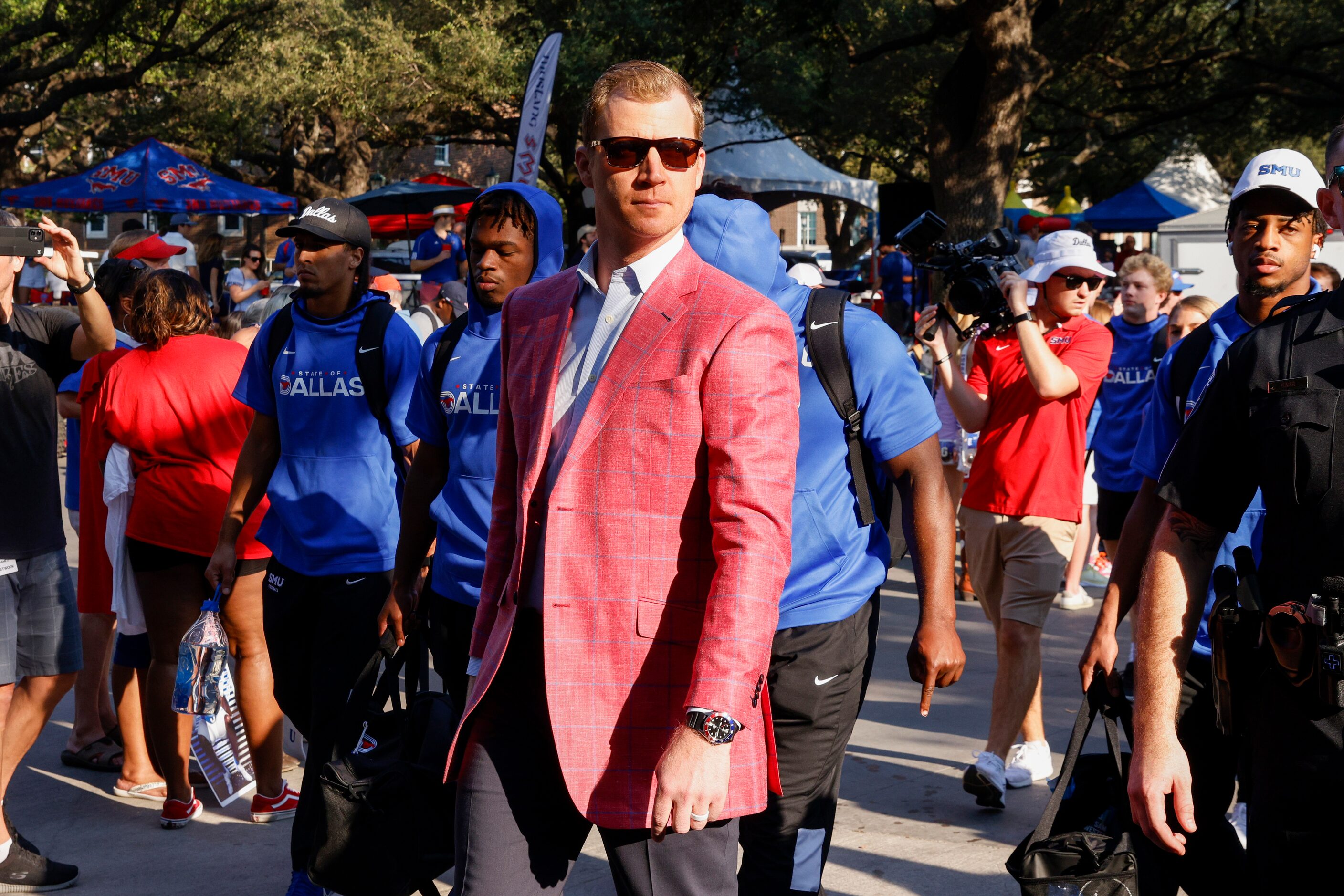 SMU head coach Rhett Lashlee walks along Bishop Boulevard before a game against TCU at Ford...