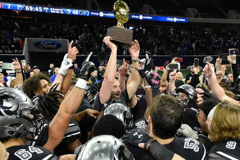 The Guyer football team celebrates after they defeat Tascosa 48-7 at the Ford Center at the...