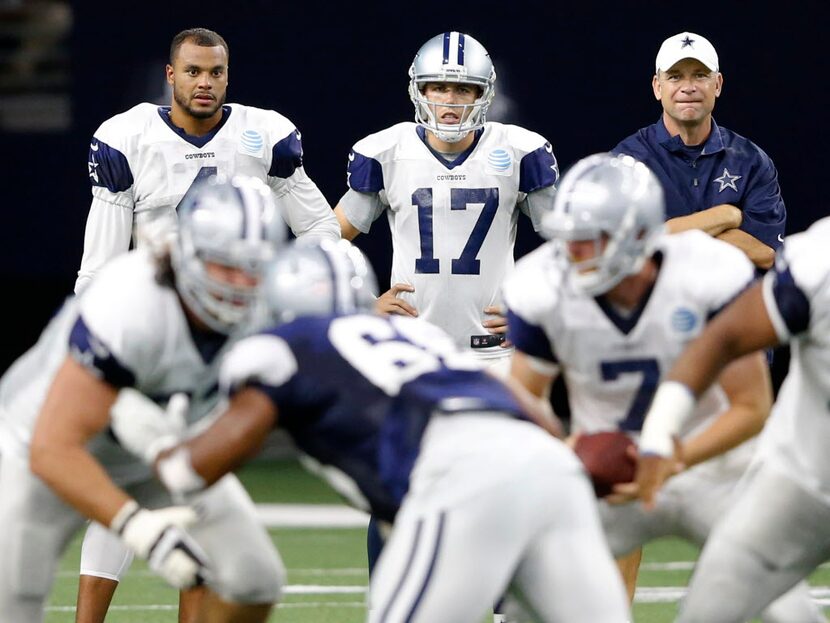 Dallas Cowboys quarterback Dak Prescott (4), Dallas Cowboys quarterback Kellen Moore (17)...