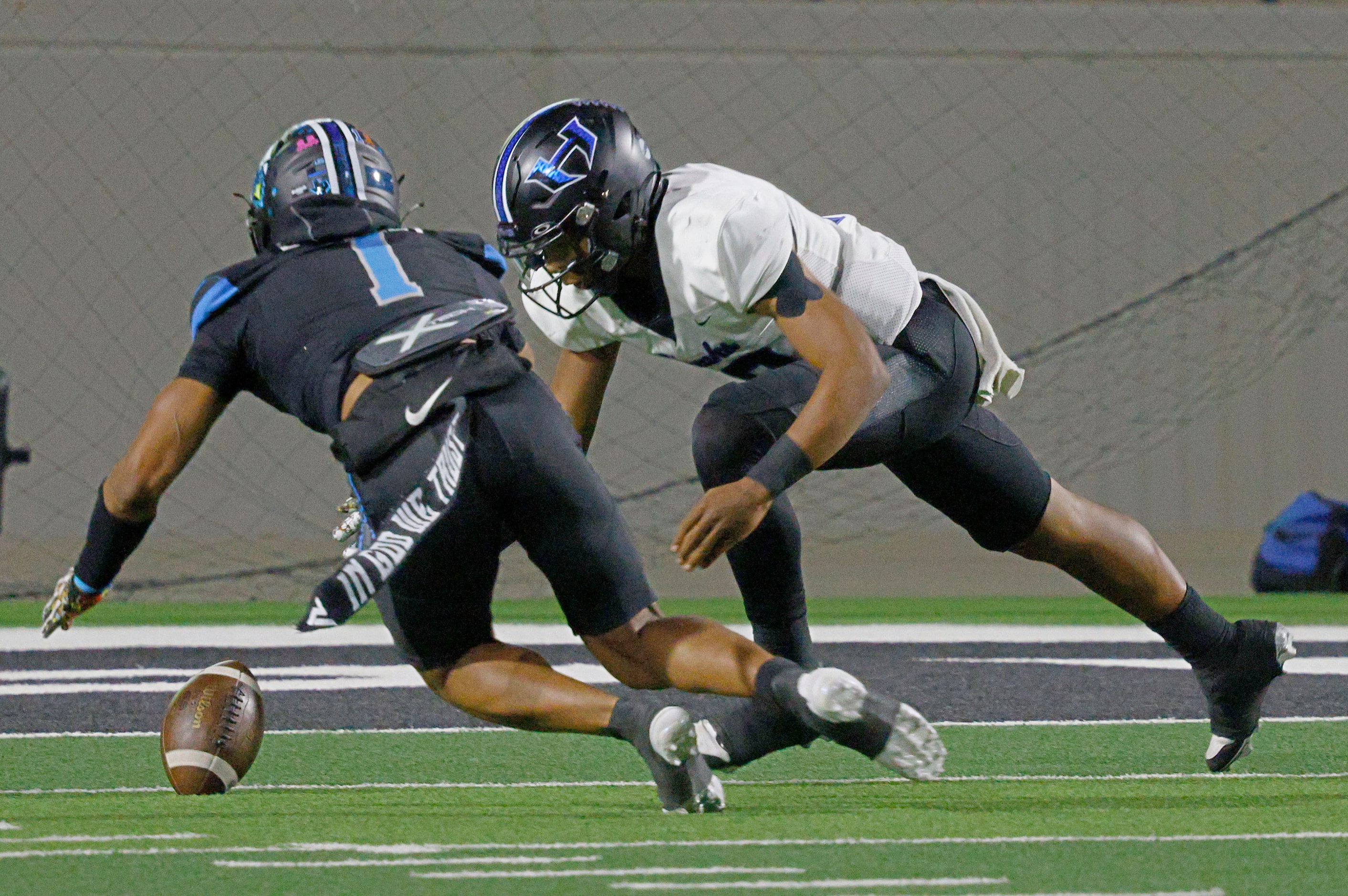 Rock Hill's Jayden Bradley (1) tries to get the ball that Hebron's quarterback Patrick...