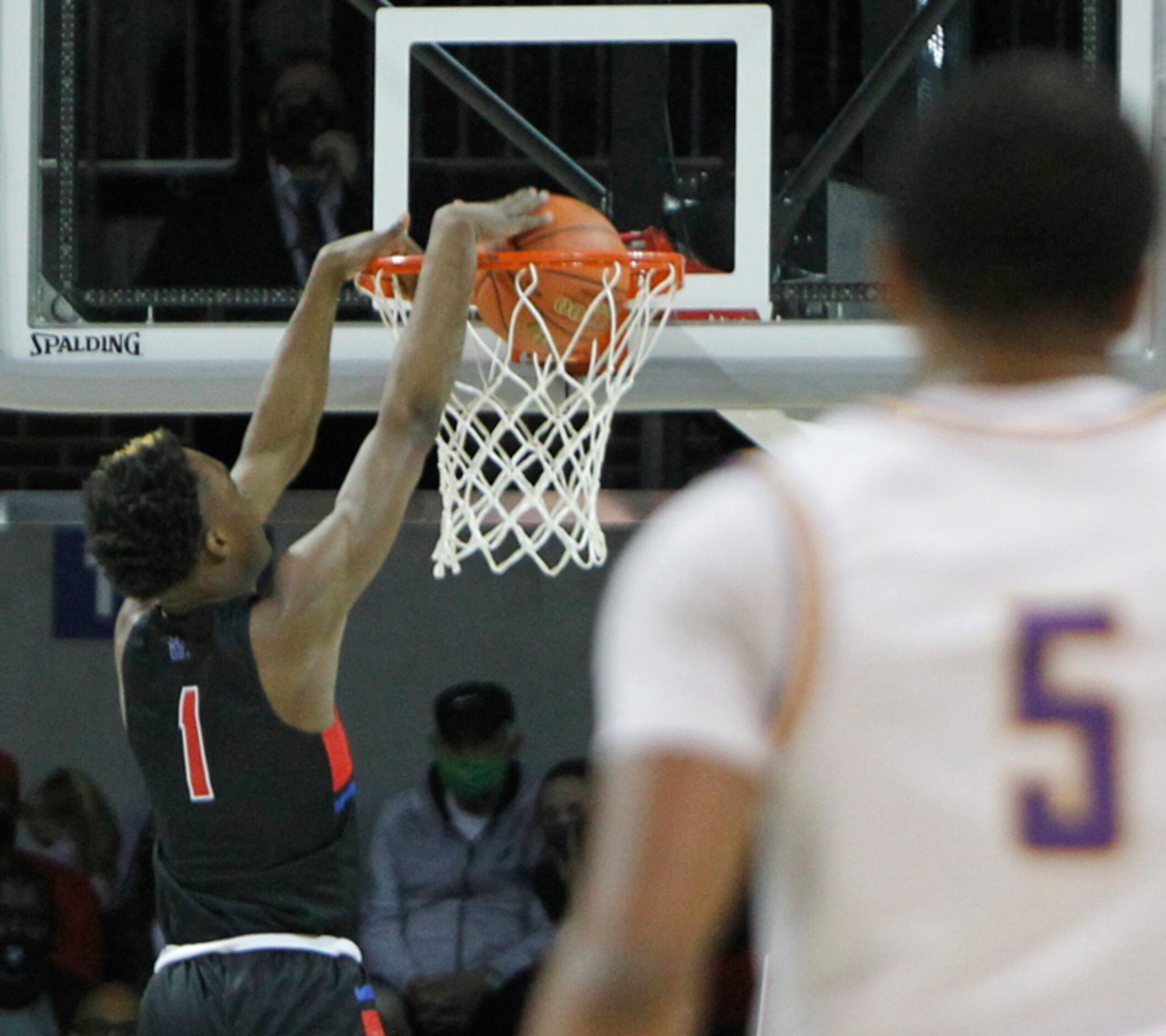 Duncanville forward Ron Holland (1) dunks to finish a fast break during first half action...