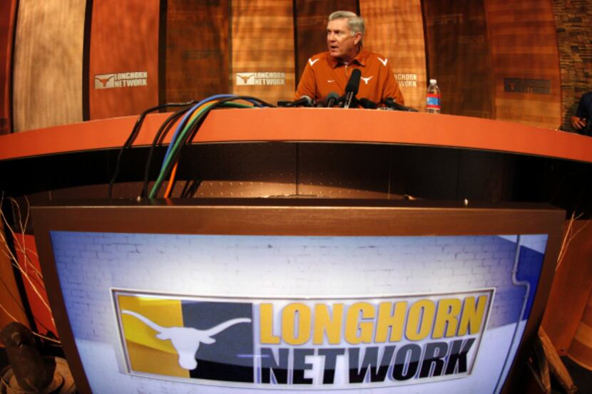 Texas head football coach Mack Brown answers question from the media on the new Longhorn...