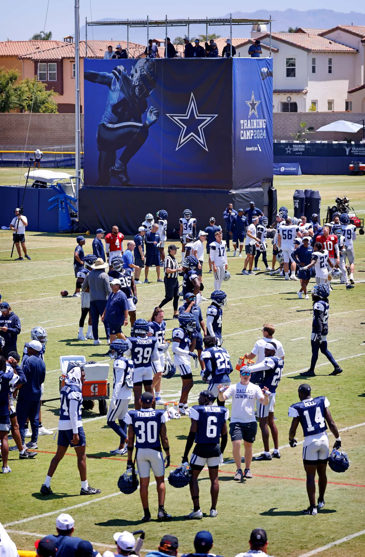 The Dallas Cowboys players take a two-minute timeout during a training camp practice in...