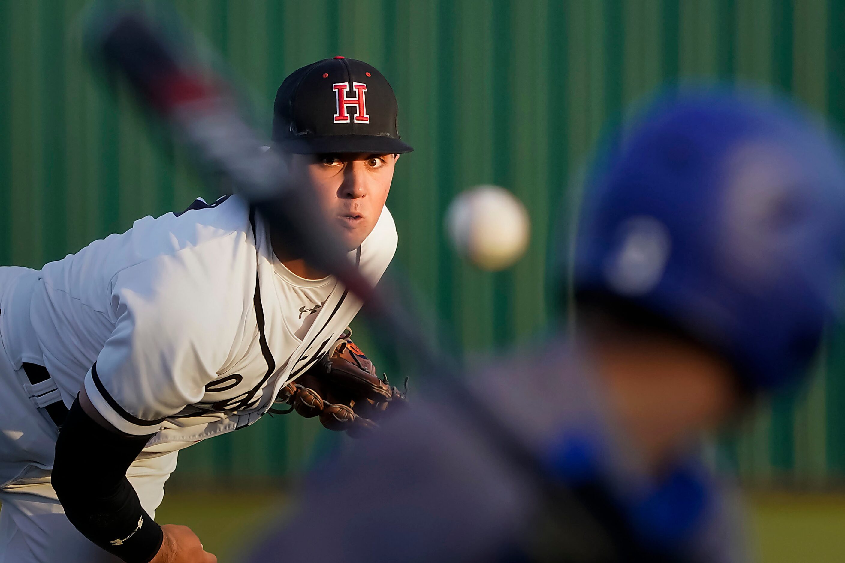 Rockwall-Heath pitcher Josh Hoover delivers to North Mesquite center fielder Liam Thornton...