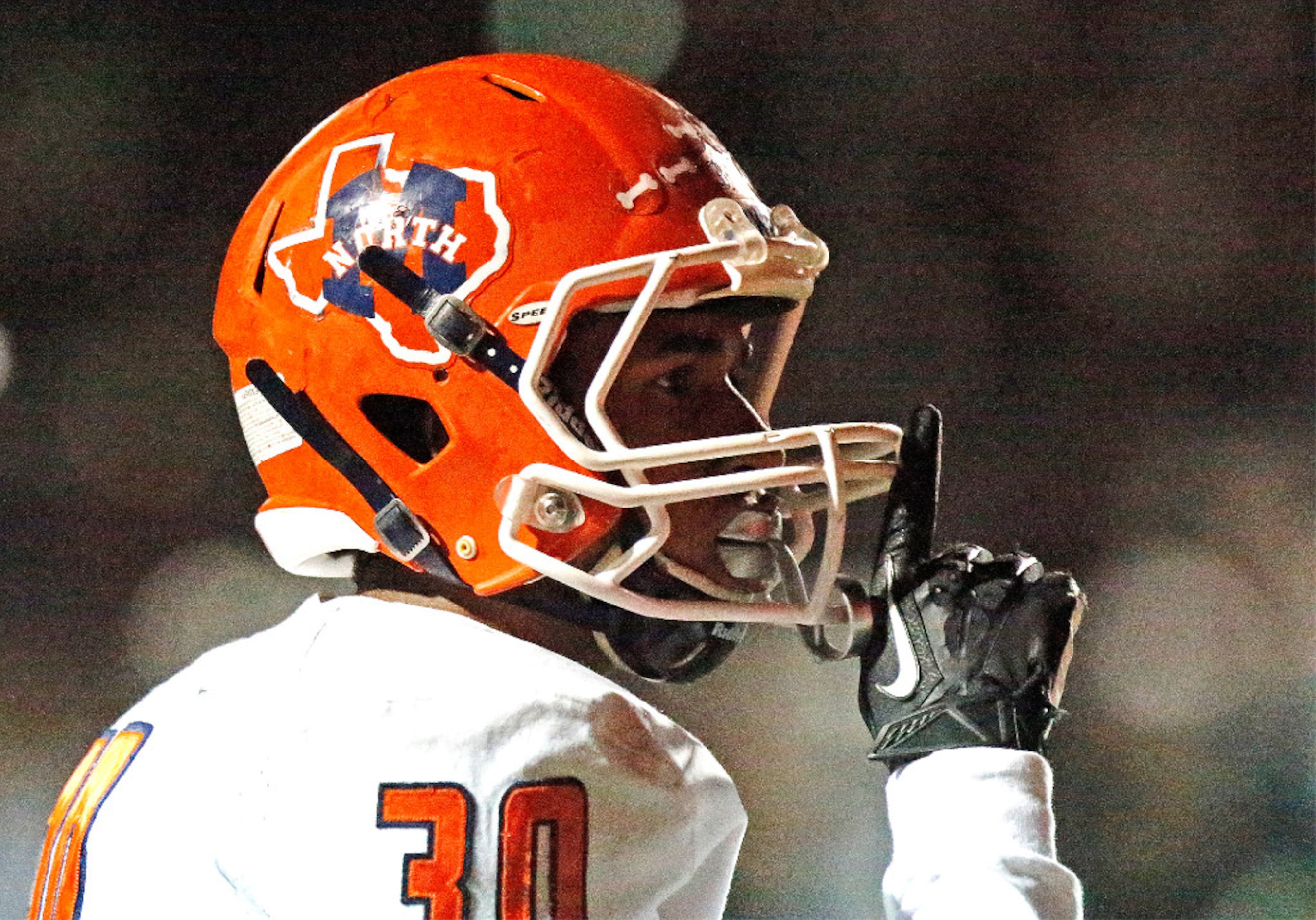 McKinney North High School defensive back Tobi Owens motions to the Prosper student section...