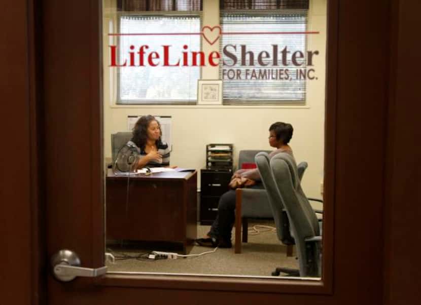 
Case worker Vivian Chambers (left) talks with client Tracy Martin on Nov. 21 at Lifeline...