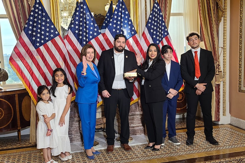 Rep. Mayra Flores, R-McAllen, reenacts her oath of office with Speaker Nancy Pelosi on June...