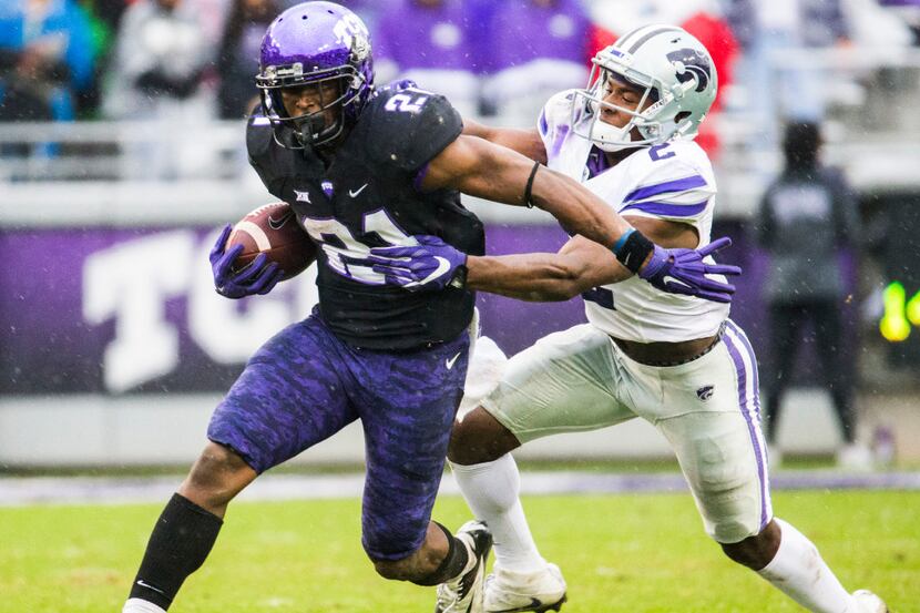 TCU Horned Frogs running back Kyle Hicks (21) is tackled by Kansas State Wildcats defensive...