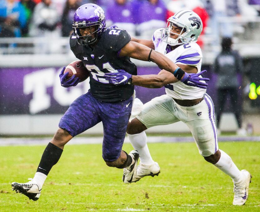 TCU Horned Frogs running back Kyle Hicks (21) is tackled by Kansas State Wildcats defensive...